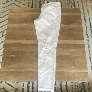 Jbrand skinny jeans with manufactured rips fringed bottoms